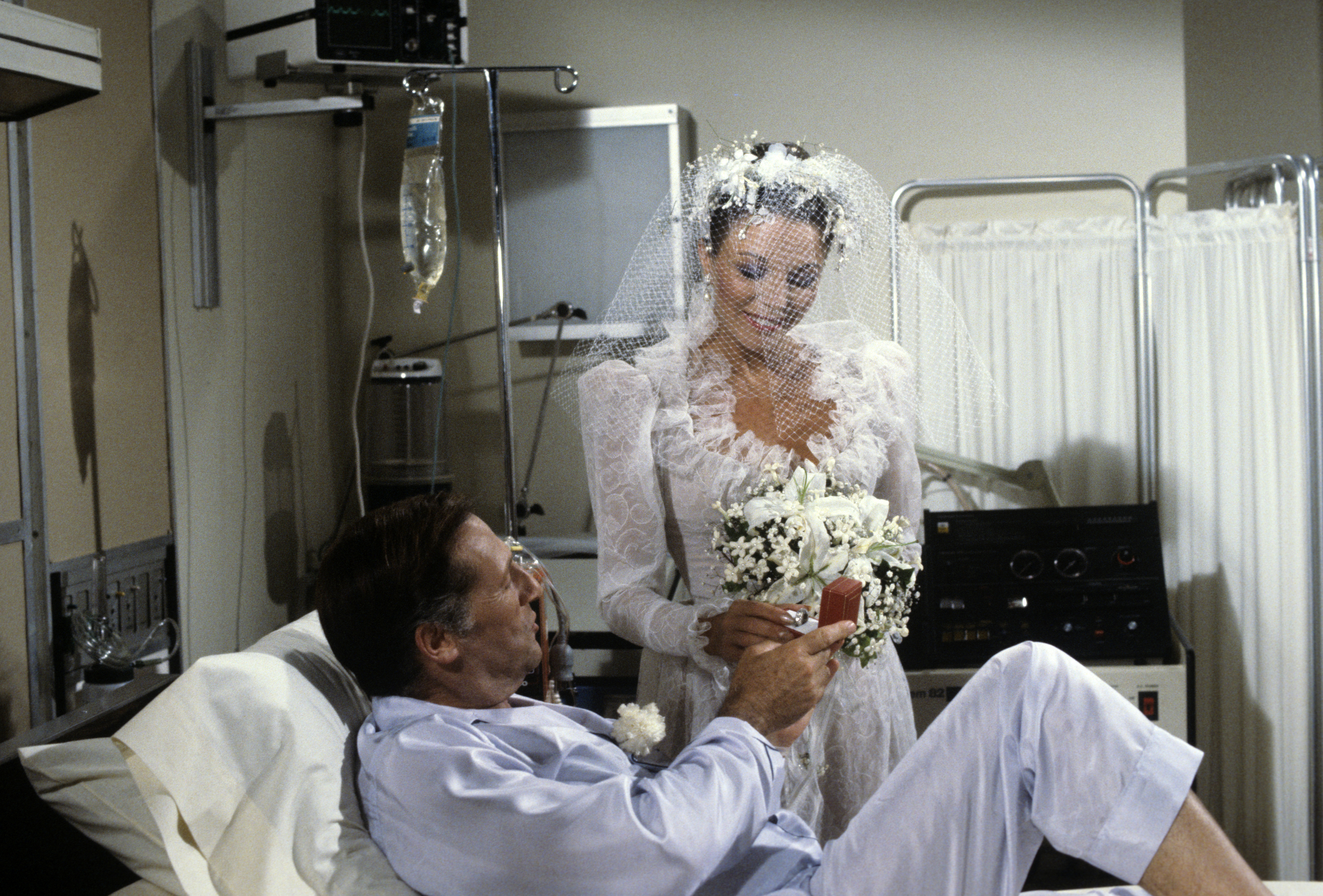 Ceil (Lloyd Bochner), and Alexis (Joan Collins) marry on his deathbed in the tv show 