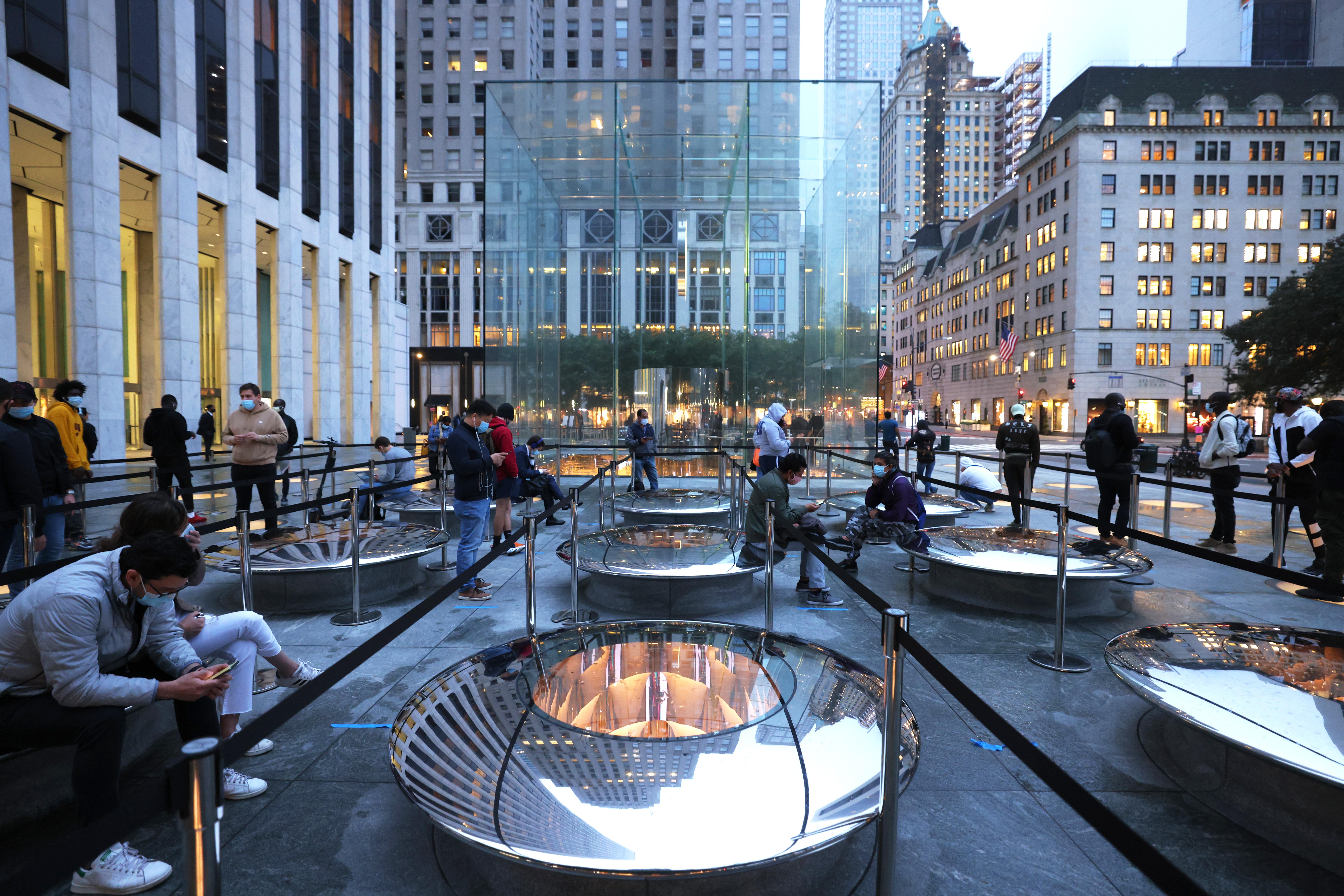 People wait in line at the Apple Fifth Avenue store for the release of the new iPhone on October 23, 2020, in New York City. The new Apple iPhone 12 was released today.