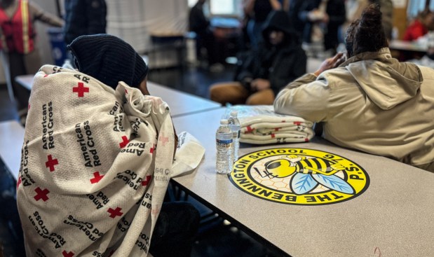 Displaced residents are pictured at P.S. 76, where they registered with the Red Cross, after a five-alarm fire in the Bronx is pictured on Friday, January 10, 2025. (Michael Appleton / Mayoral Photography Office)