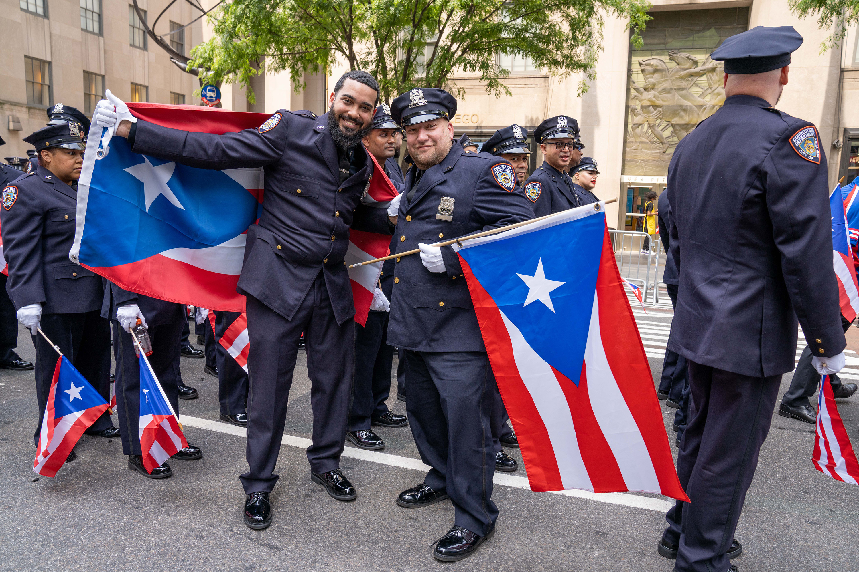 Participants pose for a photo during the Puerto Rican Day Parade along 5th Avenue in Manhattan on Sunday, June 11, 2023.