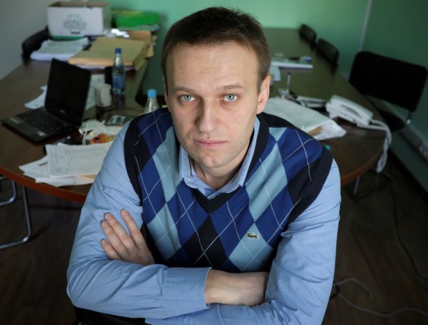 FILE - In this March 17, 2010 file photo, corporate Russian lawyer Alexei Navalny poses in his office in Moscow, Russia. Navalny, a prominent anti-corruption whistleblower, is facing a probe for damaging interests of a timber company, Russia's top investigative agency said Tuesday. Navalny rose to prominence a few years ago when he embarked on his one-man crusade against a handful of Russia's state-owned companies. (AP Photo/Alexander Zemlianichenko, file)