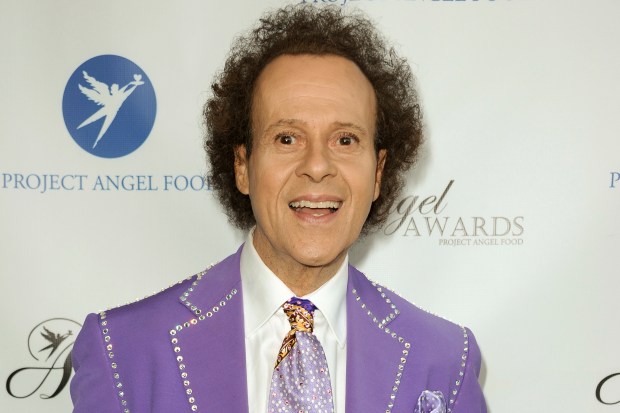 FILE - Richard Simmons arrives at the Project Angel Food's 2013 Angel Awards in Los Angeles on Aug. 10, 2013. Simmons, a fitness guru who urged the overweight to exercise and eat better, died Saturday, July 13, 2024, at the age of 76. (Photo by Richard Shotwell/Invision/AP, File, File)