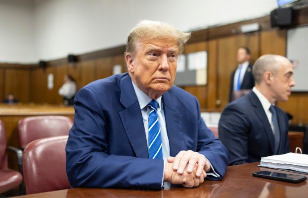 FILE - Former President Donald Trump awaits the start of proceedings on the second day of jury selection at Manhattan criminal court, April 16, 2024, in New York. Manhattan prosecutors are balking at Donald Trump efforts to delay post-trial decisions in his New York hush money criminal case as he seeks to have a federal court intervene and potentially overturn his felony conviction. They lodged their objections in a letter Tuesday to the trial judge but said they could be OK with postponing the ex-president's Sept. 18 sentencing. (Justin Lane/Pool Photo via AP)