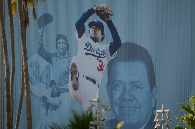 A mural is displayed of Los Angeles Dodgers legend Fernando Valenzuela at Dodger Stadium Thursday, Oct. 24, 2024, in Los Angeles. Valenzuela died Tuesday at age 63. The New York Yankees face the Dodgers in Game 1 of the baseball World Series Friday. (AP Photo/Julio Cortez)