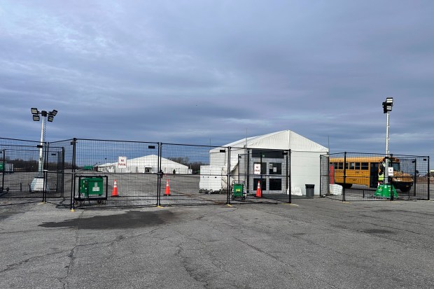 The gate at the migrant shelter, is closed at Floyd Bennett Field on Wednesday, Dec. 4, 2024 in New York.