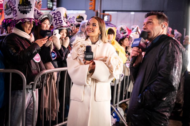 Rita Ora and Ryan Seacrest in New York's Times Square as they attend a New Year's Eve celebration, Tuesday, Dec. 31, 2024, in New York. (AP Photo/Stefan Jeremiah)