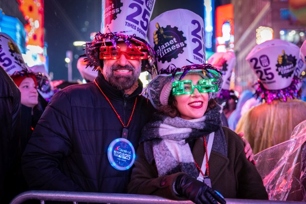 Revelers celebrate in New York's Times Square as they attend a New Year's Eve celebration, Tuesday, Dec. 31, 2024, in New York. (AP Photo/Stefan Jeremiah)