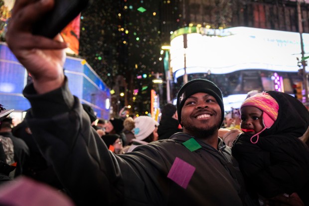 Revelers celebrate after the ball drops in New York's Times Square, Wednesday, Jan. 1, 2025, in New York. (AP Photo/Stefan Jeremiah)