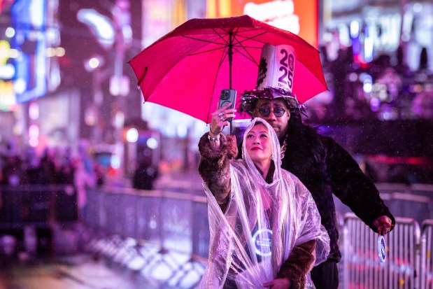 Revelers celebrate in New York's Times Square as they attend a New Year's Eve celebration, Tuesday, Dec. 31, 2024, in New York. (AP Photo/Stefan Jeremiah)