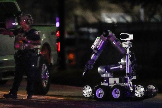 A robot is deployed into a location in Houston, Texas, Wednesday, Jan. 1, 2025, where police personnel investigate the place suspected to be associated with an attacker in a deadly rampage in New Orleans. (Brett Coomer/Houston Chronicle via AP)