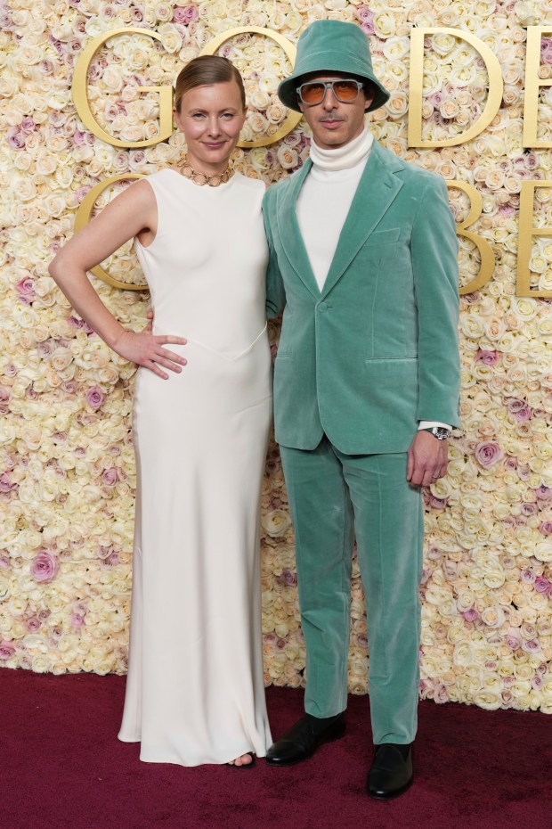 Emma Wall, left, and Jeremy Strong arrive at the 82nd Golden Globes on Sunday, Jan. 5, 2025, at the Beverly Hilton in Beverly Hills, Calif. 