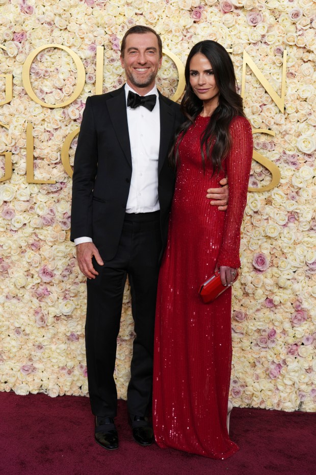 Mason Morfit, left, and Jordana Brewster arrive at the 82nd Golden Globes on Sunday, Jan. 5, 2025, at the Beverly Hilton in Beverly Hills, Calif.