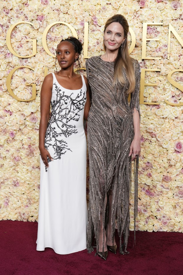 Zahara Jolie, left, and Angelina Jolie arrive at the 82nd Golden Globes on Sunday, Jan. 5, 2025, at the Beverly Hilton in Beverly Hills, Calif.