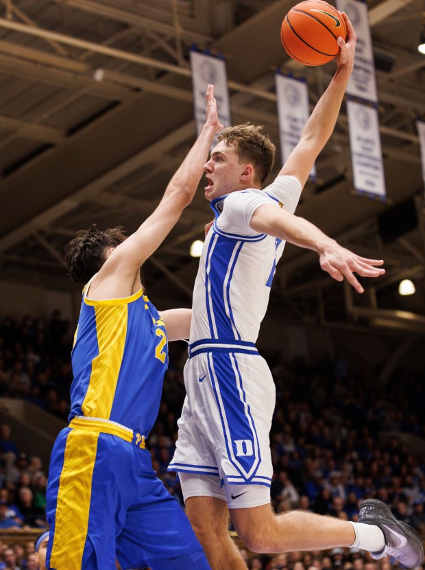 Duke's Cooper Flagg (2) dunks over Pittsburgh's Guillermo Diaz Graham