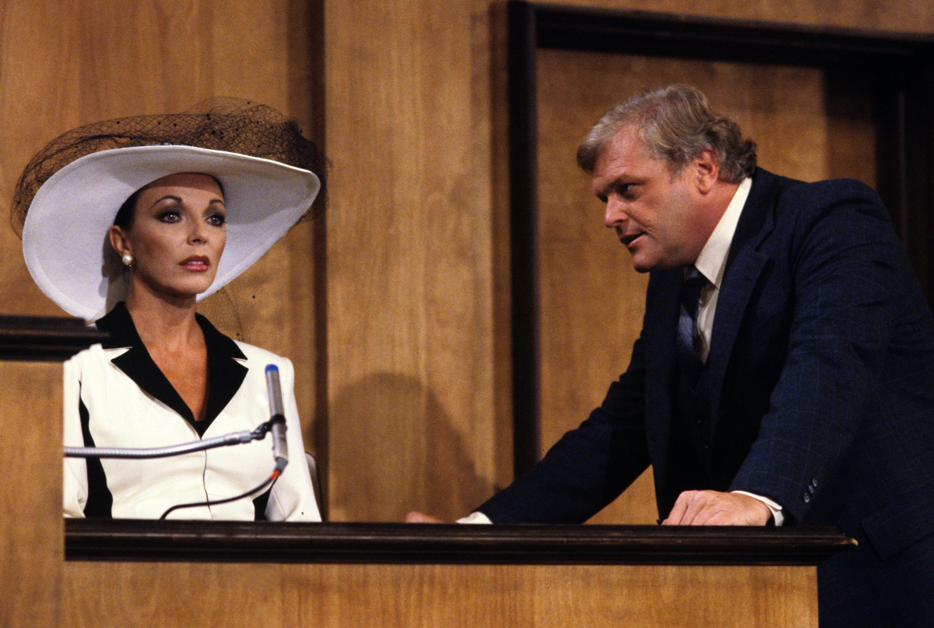 Andrew and Blake watched View of actors Joan Collins (as Alexis) and Brian Dennehy (as Jake Dunham) in a scene from the television show 'Dynasty,' episode 