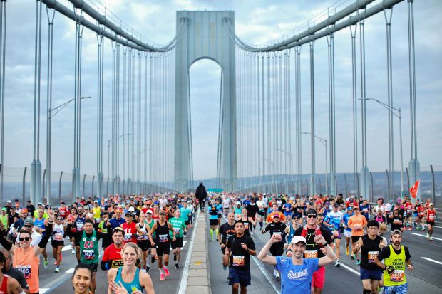 TOPSHOT - Runners cross the Verrazano Bridge before competing in the 52nd Edition of the New York City Marathon on November 5, 2023. (Photo by Kena Betancur / AFP) (Photo by KENA BETANCUR/AFP via Getty Images)