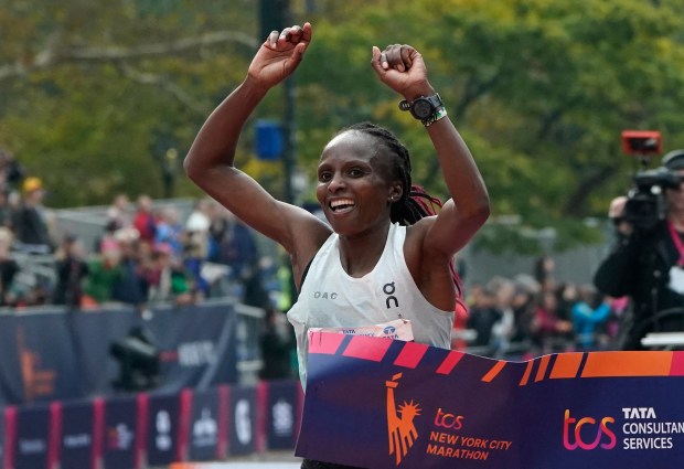 Kenya's Hellen Obiri celebrates winning the 52nd Edition of the New York City Marathon on November 5, 2023. (Photo by TIMOTHY A. CLARY / AFP) (Photo by TIMOTHY A. CLARY/AFP via Getty Images)