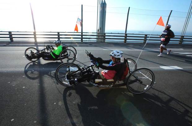 Wheelchair racers cross the Verrazzano-Narrows Bridge ahead of the 52nd Edition of the New York City Marathon on November 5, 2023. (Photo by KENA BETANCUR / AFP) (Photo by KENA BETANCUR/AFP via Getty Images)