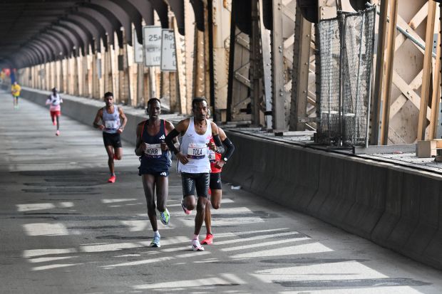 Kenya's Albert Korir (L) and Ethiopia's Tamirat Tola compete in the 52nd Edition of the New York City Marathon on November 5, 2023. (Photo by ANGELA WEISS / AFP) (Photo by ANGELA WEISS/AFP via Getty Images)