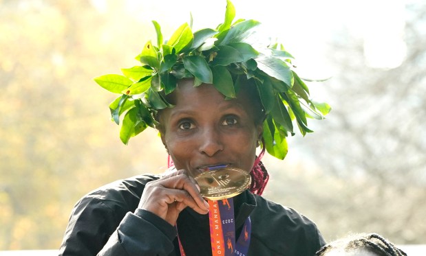 Kenya's Hellen Obiri poses on the podium after winning the 52nd Edition of the New York City Marathon on November 5, 2023. (Photo by TIMOTHY A. CLARY / AFP) (Photo by TIMOTHY A. CLARY/AFP via Getty Images)