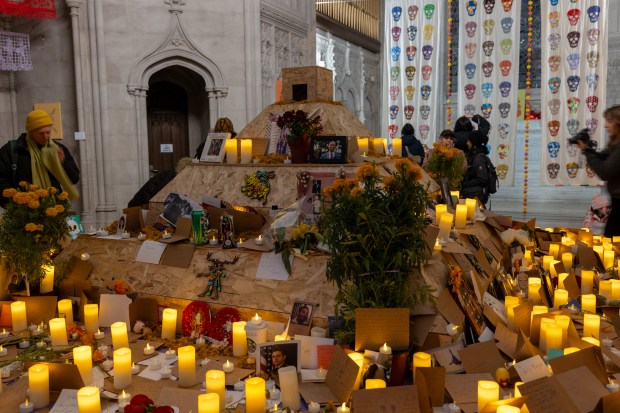 NEW YORK, NEW YORK - NOVEMBER 01: People visit a chapel with candles and remembrances of the deceased on the grounds of Greenwood Cemetery during a celebration of Día de los Muertos (Day of the Dead) in Brooklyn on November 01, 2023 in New York City. The holiday, which is celebrated throughout Latin America from October 31st to November 2nd, is used as a time for family and friends to commemorate departed loved ones through dance, music, prayer, and altars. Greenwood Cemetery, which is a national historic landmark, holds and annual day long celebration of Día de los Muertos for the community, many of whom have arrived to Brooklyn from parts of Latin America. (Photo by Spencer Platt/Getty Images)