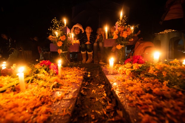 ZARAGOZA, VZ, MEXICO - NOVEMBER 1: A general view as people attend their relatives graves during 'Day of the Dead' celebrations on November 1, 2023 in Zaragoza, Veracruz, Mexico. The Day of the Dead takes place every year on November 1 and 2. The celebration is one of the most colorful and popular in the country bringing millions of tourists to witness how people set offerings, decorate homes and cemeteries and organize family gatherings as a tribute to the dead. (Photo by Hector AD Quintanar/Getty Images)