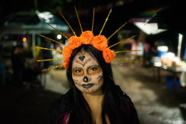 ZARAGOZA, VZ, MEXICO - NOVEMBER 1: A general view as people attend their relatives graves during 'Day of the Dead' celebrations on November 1, 2023 in Zaragoza, Veracruz, Mexico. The Day of the Dead takes place every year on November 1 and 2. The celebration is one of the most colorful and popular in the country bringing millions of tourists to witness how people set offerings, decorate homes and cemeteries and organize family gatherings as a tribute to the dead. (Photo by Hector AD Quintanar/Getty Images)