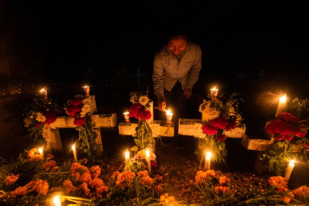 ZARAGOZA, VZ, MEXICO - NOVEMBER 1: A general view as people attend their relatives graves during 'Day of the Dead' celebrations on November 1, 2023 in Zaragoza, Veracruz, Mexico. The Day of the Dead takes place every year on November 1 and 2. The celebration is one of the most colorful and popular in the country bringing millions of tourists to witness how people set offerings, decorate homes and cemeteries and organize family gatherings as a tribute to the dead. (Photo by Hector AD Quintanar/Getty Images)