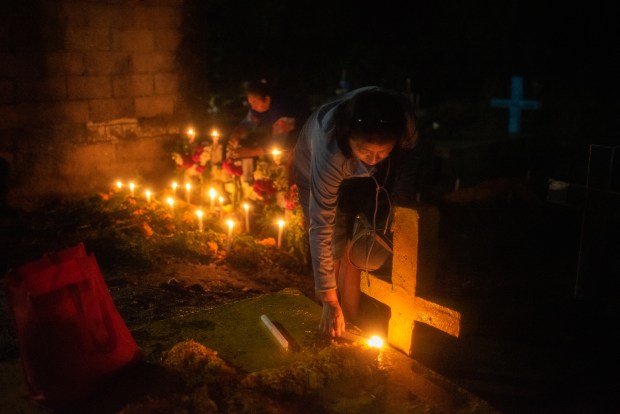 ZARAGOZA, VZ, MEXICO - NOVEMBER 1: A general view as people attend their relatives graves during 'Day of the Dead' celebrations on November 1, 2023 in Zaragoza, Veracruz, Mexico. The Day of the Dead takes place every year on November 1 and 2. The celebration is one of the most colorful and popular in the country bringing millions of tourists to witness how people set offerings, decorate homes and cemeteries and organize family gatherings as a tribute to the dead. (Photo by Hector AD Quintanar/Getty Images)