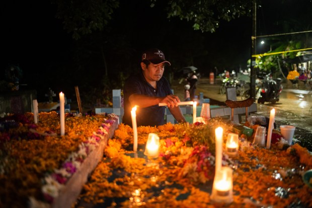 ZARAGOZA, VZ, MEXICO - NOVEMBER 1: A general view as people attend their relatives graves during 'Day of the Dead' celebrations on November 1, 2023 in Zaragoza, Veracruz, Mexico. The Day of the Dead takes place every year on November 1 and 2. The celebration is one of the most colorful and popular in the country bringing millions of tourists to witness how people set offerings, decorate homes and cemeteries and organize family gatherings as a tribute to the dead. (Photo by Hector AD Quintanar/Getty Images)