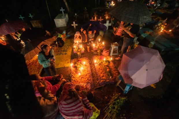 ZARAGOZA, VZ, MEXICO - NOVEMBER 1: A general view as people attend their relatives graves during 'Day of the Dead' celebrations on November 1, 2023 in Zaragoza, Veracruz, Mexico. The Day of the Dead takes place every year on November 1 and 2. The celebration is one of the most colorful and popular in the country bringing millions of tourists to witness how people set offerings, decorate homes and cemeteries and organize family gatherings as a tribute to the dead. (Photo by Hector AD Quintanar/Getty Images)