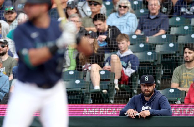 Jarret DeHart, as a member of the Seattle Mariners, looks on during a game against the Chicago White Sox at T-Mobile Park on June 10, 2024 in Seattle, Washington. (Photo by Steph Chambers/Getty Images)