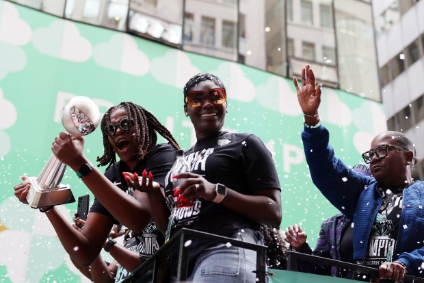 NEW YORK, NEW YORK - OCTOBER 24: Jonquel Jones #35 of the New York Liberty carries the MVP trophy while waving to the crowd during the New York Liberty Ticker Tape Victory Parade & Rally on October 24, 2024 in New York City. (Photo by Sarah Stier/Getty Images)