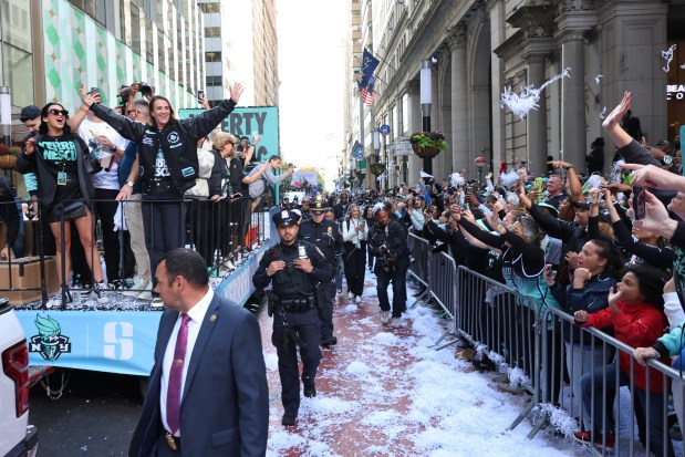 NEW YORK, NEW YORK - OCTOBER 24: New York Liberty Guard Sabrina Ionescu celebrates the team winning the WNBA championship during their parade on October 24, 2024 in New York City. Fans lined the streets north along Broadway to City Hall through what's known as the "Canyon of Heroes" to celebrate the Liberty's first WNBA championship after a 67-62 overtime victory on Sunday over the Minnesota Lynx. The Liberty were the top seed with a league-best 32-8 record. (Photo by Michael M. Santiago/Getty Images)