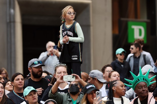 NEW YORK, NEW YORK - OCTOBER 24: Fans cheer during the New York Liberty Ticker Tape Victory Parade & Rally on October 24, 2024 in New York City. (Photo by Sarah Stier/Getty Images)