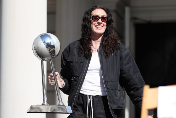 NEW YORK, NEW YORK - OCTOBER 24: Breanna Stewart #30 of the New York Liberty carries the Championship trophy during the championship ticker tape parade and victory rally celebrating winning the 2024 WNBA Finals on October 24, 2024 in New York City. NOTE TO USER: User expressly acknowledges and agrees that, by downloading and/or using this photograph, user is consenting to the terms and conditions of the Getty Images License Agreement. (Photo by Elsa/Getty Images)