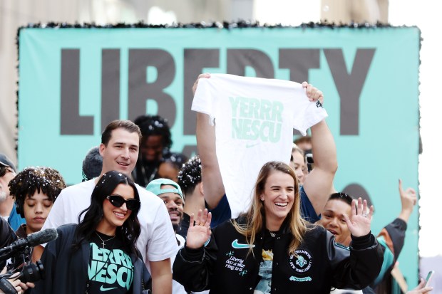 NEW YORK, NEW YORK - OCTOBER 24: Sabrina Ionescu #20 of the New York Liberty waves to the crowd during the New York Liberty Ticker Tape Victory Parade & Rally on October 24, 2024 in New York City. (Photo by Sarah Stier/Getty Images)