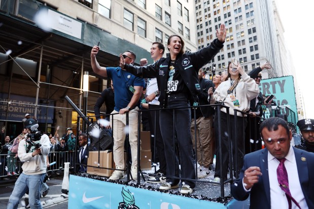 NEW YORK, NEW YORK - OCTOBER 24: Sabrina Ionescu #20 of the New York Liberty waves to the crowd during the New York Liberty Ticker Tape Victory Parade & Rally on October 24, 2024 in New York City. (Photo by Sarah Stier/Getty Images)