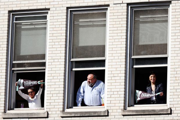 NEW YORK, NEW YORK - OCTOBER 24: Fans cheer from windows during the New York Liberty Ticker Tape Victory Parade & Rally on October 24, 2024 in New York City. (Photo by Sarah Stier/Getty Images)