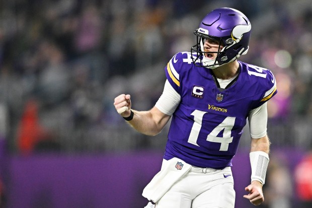 MINNEAPOLIS, MINNESOTA - DECEMBER 29: Sam Darnold #14 of the Minnesota Vikings reacts after a throwing a touchdown pass during the second quarter against the Green Bay Packers at U.S. Bank Stadium on December 29, 2024 in Minneapolis, Minnesota. (Photo by Stephen Maturen/Getty Images)