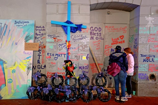 NEW ORLEANS, LOUISIANA - JANUARY 4: Crosses, wreathes, and painted messages are part of a memorial on Bourbon Street at Canal Street as people gather for a vigil for the victims on January 4, 2025 in New Orleans, Louisiana. Fourteen people were killed and over 30 were injured when a driver intentionally drove into a crowd on Bourbon Street in the early morning hours of New Year's Day in what police are calling a terrorist attack. (Photo by Michael DeMocker/Getty Images)