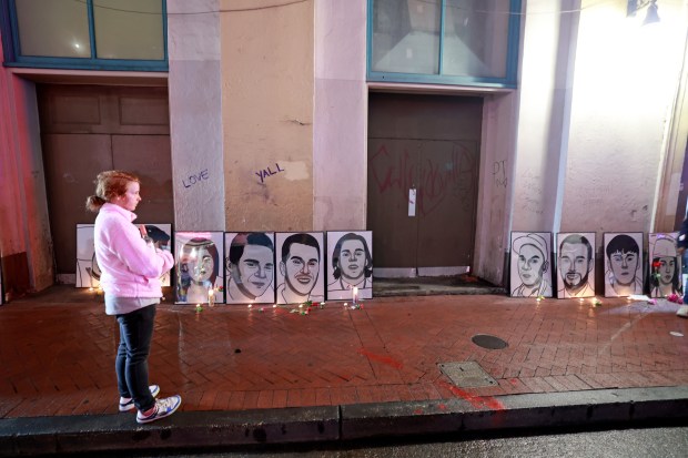 NEW ORLEANS, LOUISIANA - JANUARY 4: Framed portraits of the victims lean against a wall on Bourbon Street at Canal Street as people gather for a vigil on January 4, 2025 in New Orleans, Louisiana. Fourteen people were killed and over 30 were injured when a driver intentionally drove into a crowd on Bourbon Street in the early morning hours of New Year's Day in what police are calling a terrorist attack. (Photo by Michael DeMocker/Getty Images)