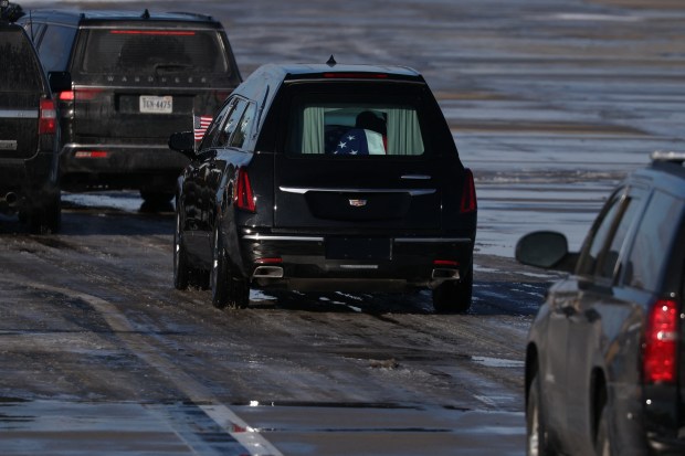 The flag-draped casket of former US President Jimmy Carter is tranfered to a hearse during an arrival ceremony in Joint Base Andrews, Maryland, on January 7, 2025. Carter, the 39th President of the United States, died at the age of 100 on December 29, 2024 at his home in Plains, Georgia. (Photo by Samuel Corum / AFP) (Photo by SAMUEL CORUM/AFP via Getty Images)