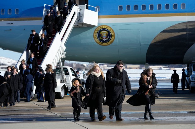 Members of the Carter family arrive on Special Air Mission 39, before the casket with the body of former US president Jimmy Carter is removed from the plane at Joint Base Andrews, Maryland on January 7, 2025. Carter, the 39th President of the United States, died at the age of 100 on December 29, 2024 at his home in Plains, Georgia. (Photo by Susan Walsh / POOL / AFP) (Photo by SUSAN WALSH/POOL/AFP via Getty Images)