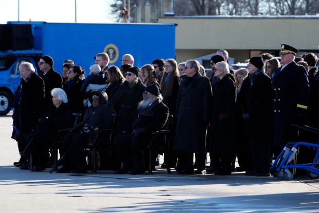 Members of the Carter family watch as joint forces body bearer team moves the flag-draped casket of former President Jimmy Carter upon arrival at Joint Base Andrews, Maryland on January 7, 2025. Carter, the 39th President of the United States, died at the age of 100 on December 29, 2024 at his home in Plains, Georgia. (Photo by Susan Walsh / POOL / AFP) (Photo by SUSAN WALSH/POOL/AFP via Getty Images)