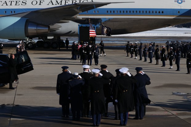 Members of a military honor cordon transfer the flag-draped casket of former US President Jimmy Carter to a hearse during an arrival ceremony in Joint Base Andrews, Maryland, on January 7, 2025. Carter, the 39th President of the United States, died at the age of 100 on December 29, 2024 at his home in Plains, Georgia. (Photo by Samuel Corum / AFP) (Photo by SAMUEL CORUM/AFP via Getty Images)