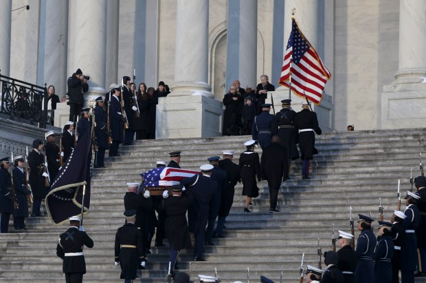 WASHINGTON, DC - JANUARY 7: The flag-draped casket of former President Jimmy Carter is carried into the U.S. Capitol on January 7, 2025 in Washington, DC. Carter's body will lie in state in the Capitol Rotunda until a funeral service at the National Cathedral in Washington on January 9. Carter, the 39th President of the United States, died at the age of 100 on December 29, 2024 at his home in Plains, Georgia. (Photo by Evelyn Hockstein-Pool/Getty Images)