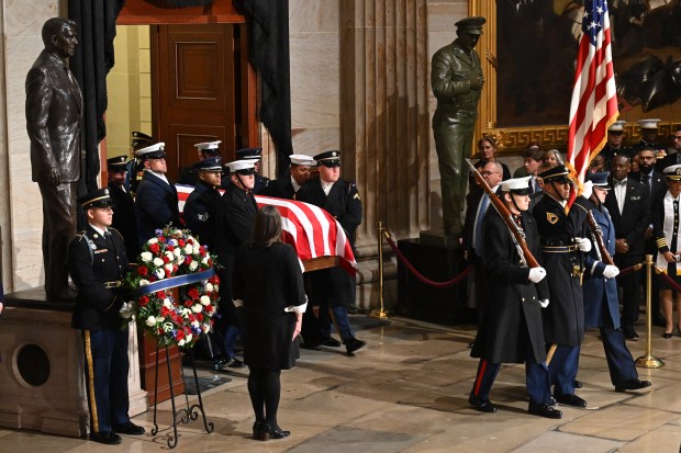 The flag-draped casket of former US President Jimmy Carter is carried by military body bearers to the US Capitol Rotunda, where he will lie in state, in Washington, DC, on January 7, 2025. Carter, the 39th President of the United States, died at the age of 100 on December 29, 2024 at his home in Plains, Georgia. (Photo by SAUL LOEB / POOL / AFP) (Photo by SAUL LOEB/POOL/AFP via Getty Images)