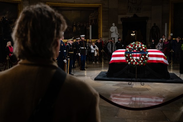 WASHINGTON, DC - JANUARY 7: Members of the public view the casket of President Jimmy Carter as his body lies in state in the Capitol Rotunda on January 7, 2025 in Washington, DC. Carter's body will lie in state in the Capitol Rotunda until a funeral service at the National Cathedral in Washington on January 9. Carter, the 39th President of the United States, died at the age of 100 on December 29, 2024 at his home in Plains, Georgia.(Photo by Jon Cherry/Getty Images)