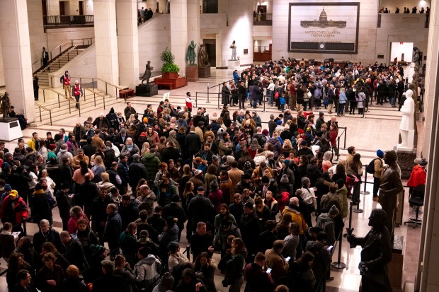 WASHINGTON, DC - JANUARY 7: Members of the public wait to view the casket of former President Jimmy Carter during a ceremony in the Rotunda of the U.S. Capitol on January 7, 2025 in Washington, DC. Carter's body will lie in state in the Capitol Rotunda until a funeral service at the National Cathedral in Washington on January 9. Carter, the 39th President of the United States, died at the age of 100 on December 29, 2024 at his home in Plains, Georgia. (Photo by Nathan Howard/Getty Images)